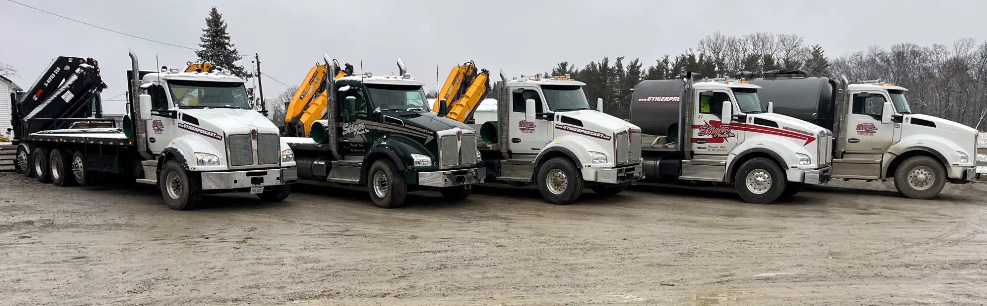 Stiger Precast trucks parked in a line.