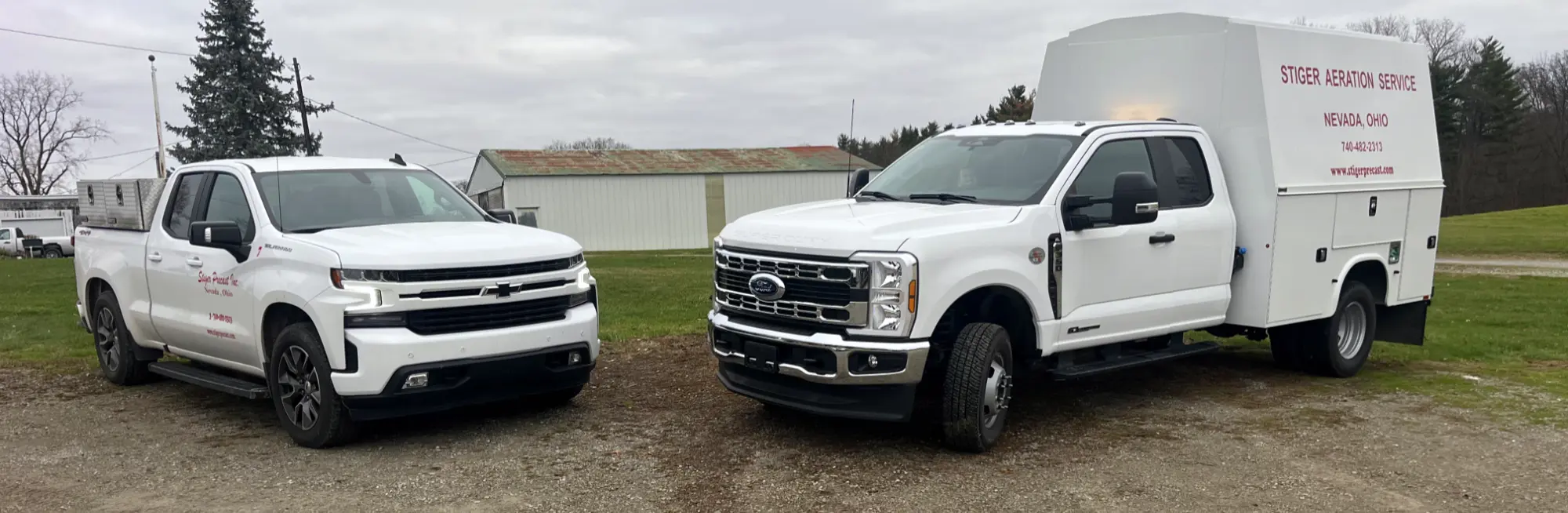 two aeration service trucks